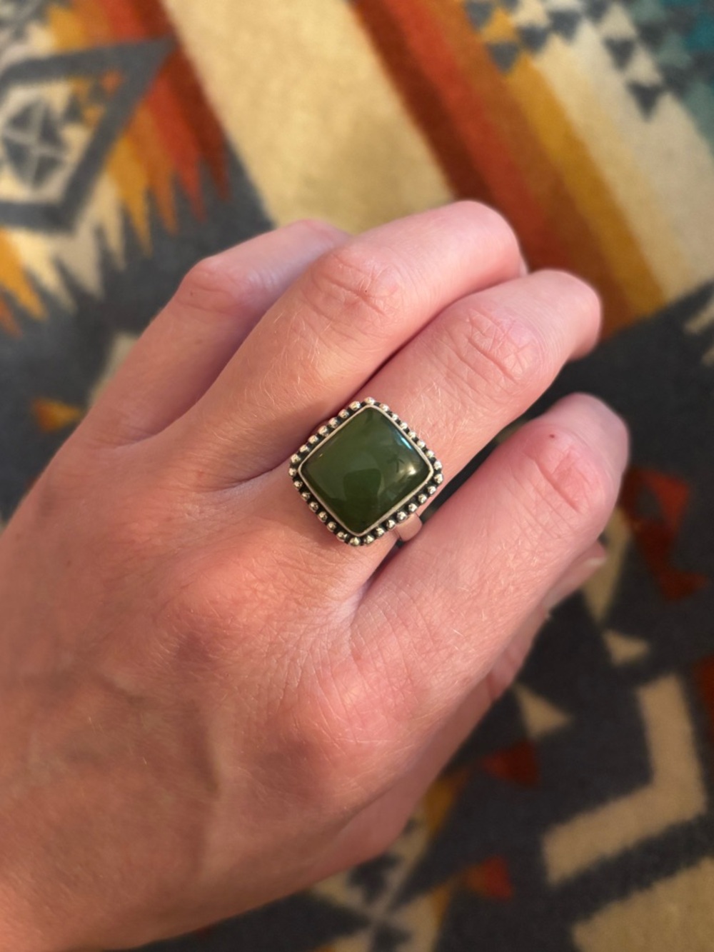 Vintage jade ring with silver halo detail